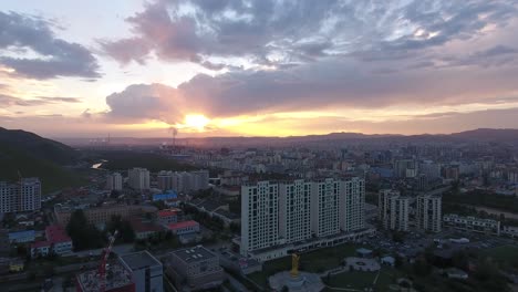 Aerial-drone-shot-during-sunset-in-oulan-bator-Mongolia.-Building-and-river